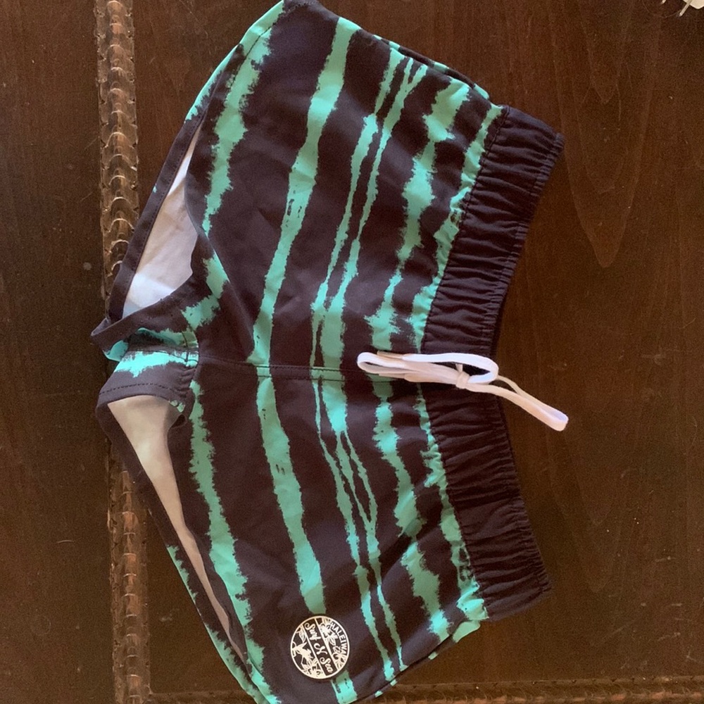 Swim/surf shorts. Great sun protection.